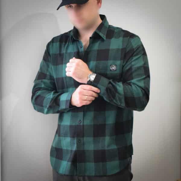 Man in cap and green shirt