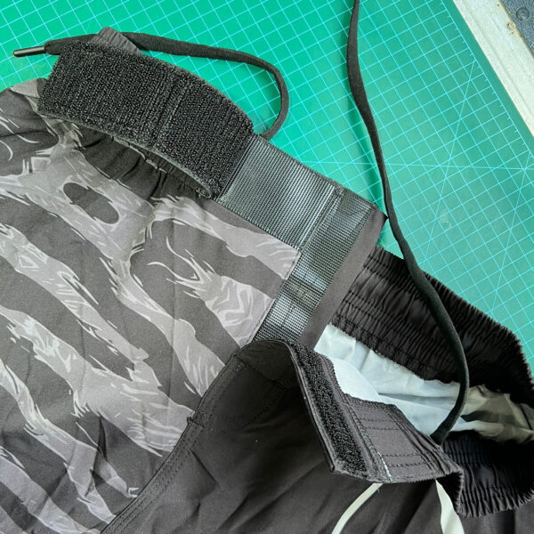 Double velcro fly shown on the black night tiger board shorts