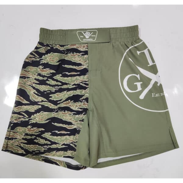 Green Tiger Shorts on white background laid flat